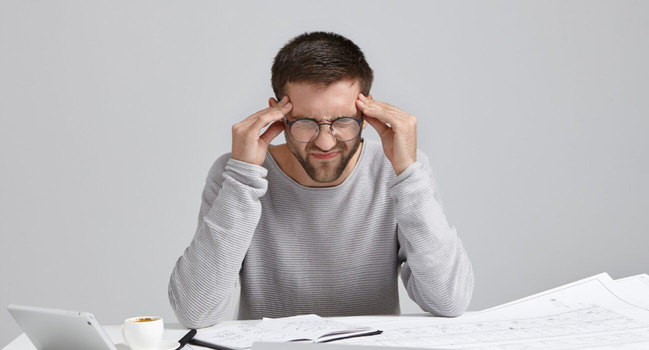 Man sitting alone thinking about rebuilding his life after failure