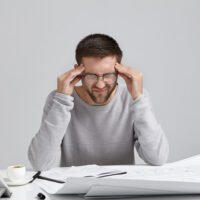 Man sitting alone thinking about rebuilding his life after failure