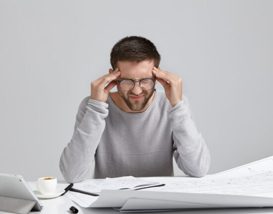 Man sitting alone thinking about rebuilding his life after failure