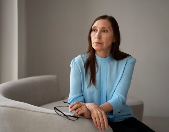 Woman reflecting on emotional stress and unhealthy relationship warning signs