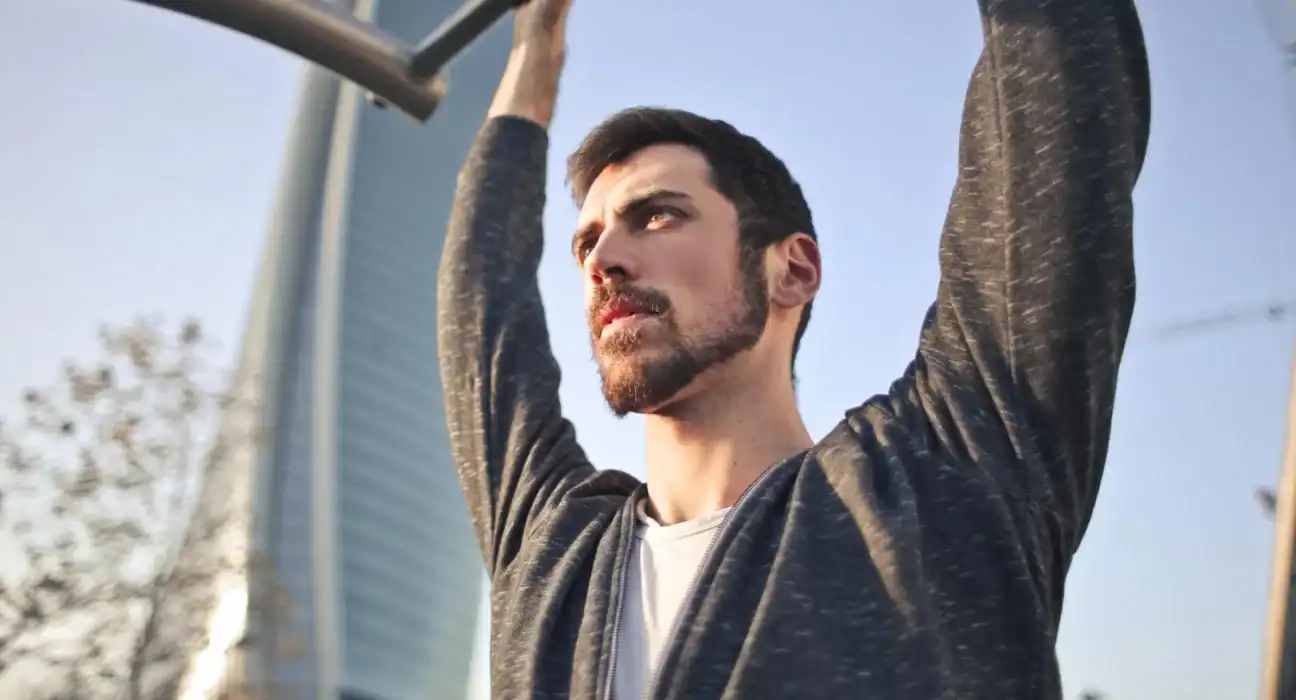 Man exercising outdoors, symbolizing overcoming barriers to change.