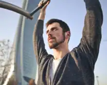 Man exercising outdoors, symbolizing overcoming barriers to change.